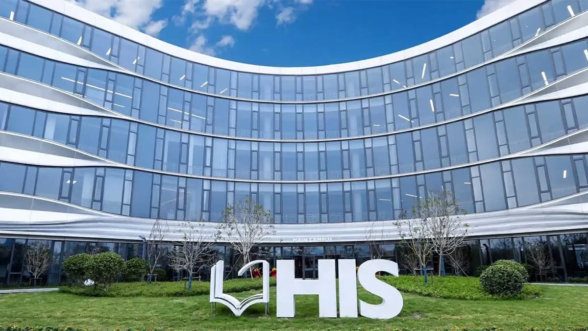 Hangzhou International School modern campus building with curved glass facade and lawn