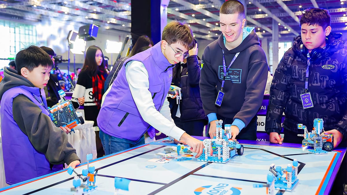 STEM Study Tours students testing robotics on competition mat at international event