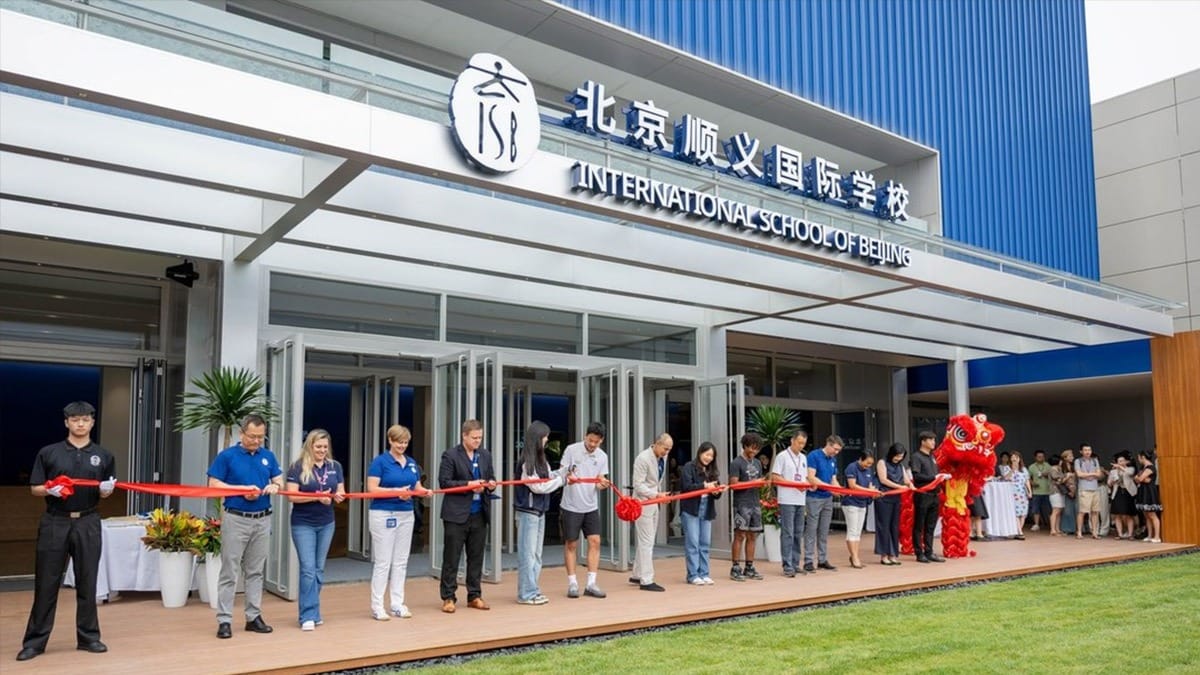 International School of Beijing ribbon-cutting ceremony with staff and traditional lion dance