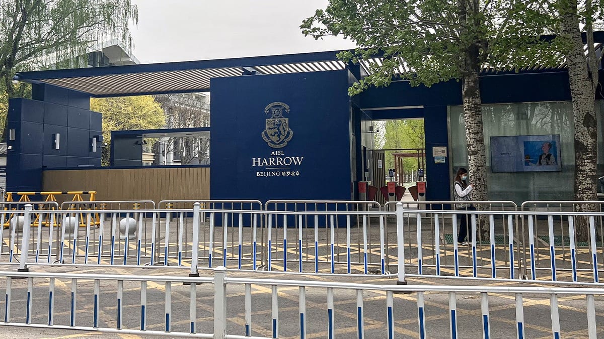 Harrow International School Beijing entrance with navy blue gates and school crest signage