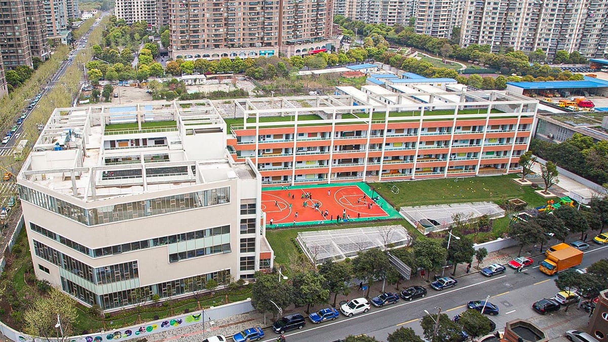 Shanghai Hongqiao International School aerial view showing campus buildings and sports courts