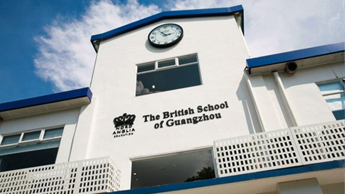 The British School of Guangzhou white building with clock tower and blue trim