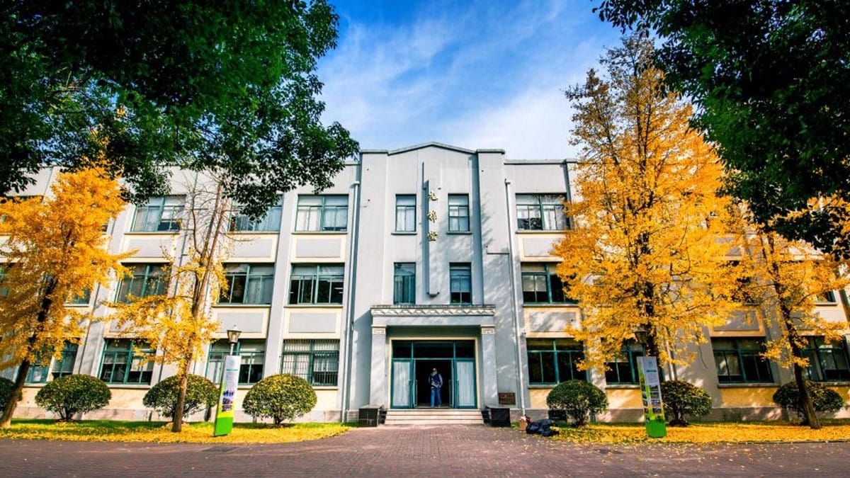 Shanghai High School International Division building surrounded by autumn foliage
