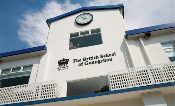 British School of Guangzhou main building exterior with clock and blue trim detailing