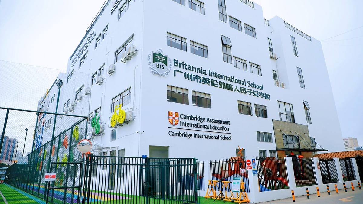 Britannia International School Guangzhou building with Cambridge signage and sports court