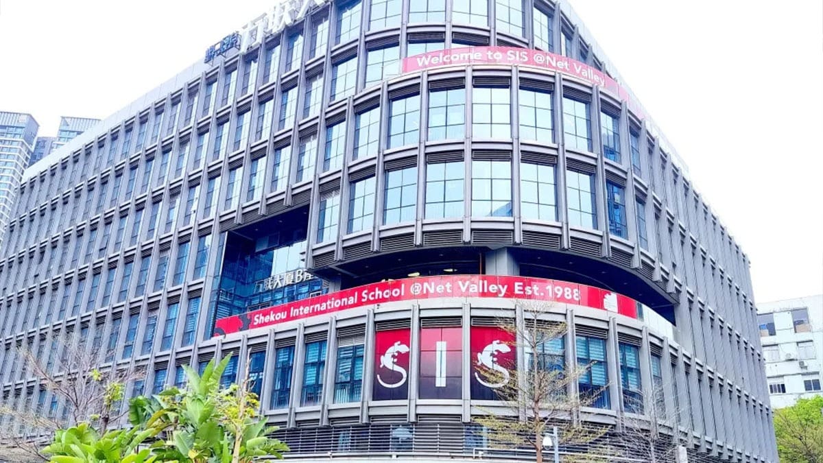 Shekou International School modern glass building with distinctive red signage