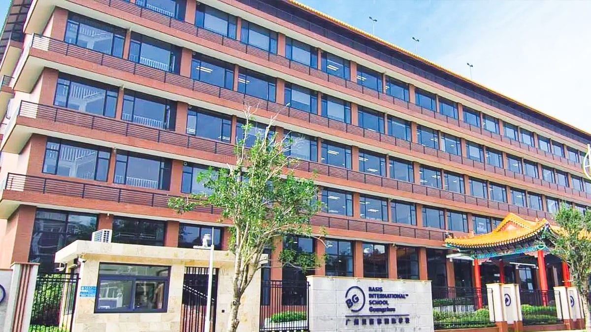 BASIS International School Guangzhou red brick building with traditional Chinese gate element
