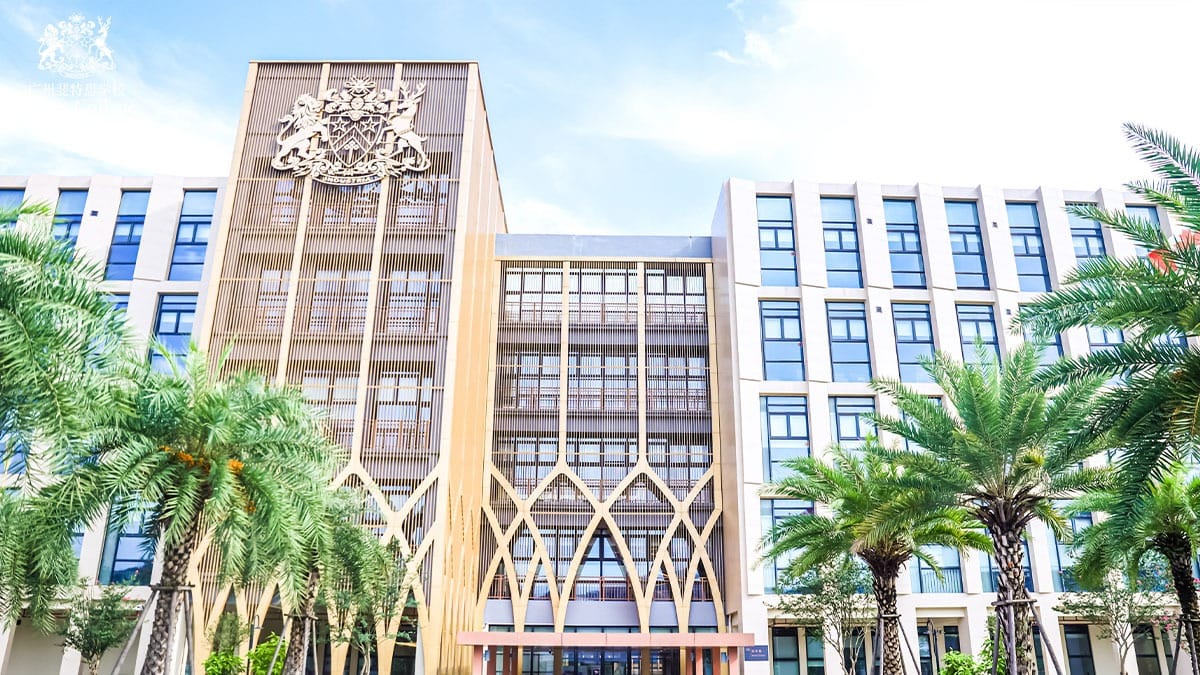 Fettes College Guangzhou campus building with coat of arms and palm trees