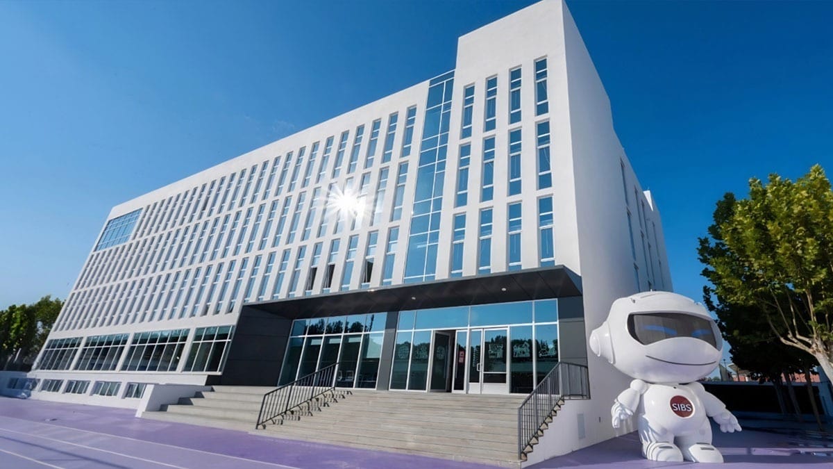Springboard International Bilingual School modern campus building with mascot statue