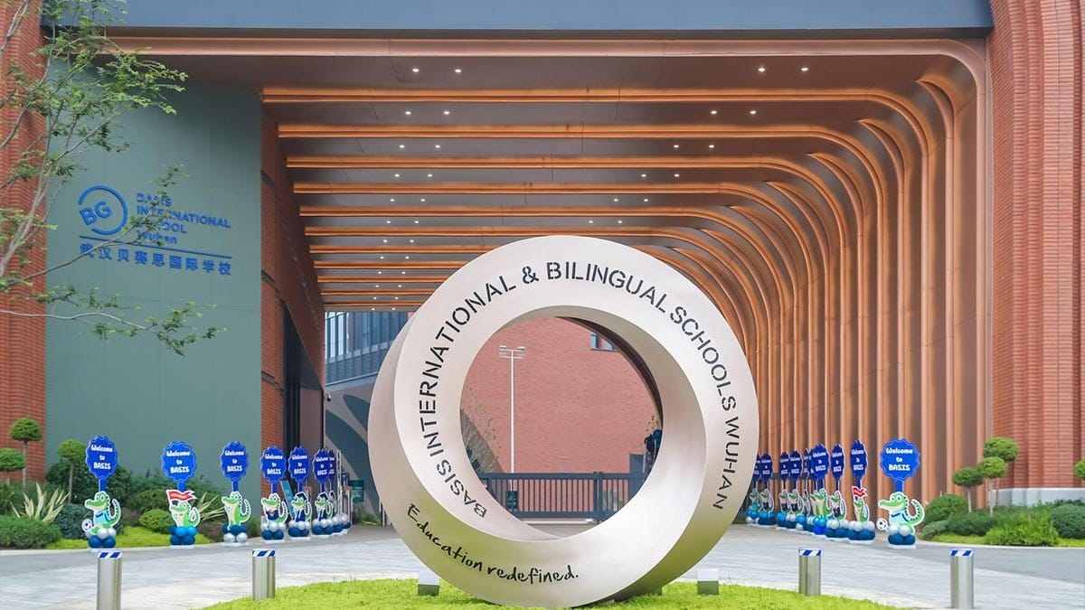 BASIS International School Wuhan Campus entrance with a spiral signage