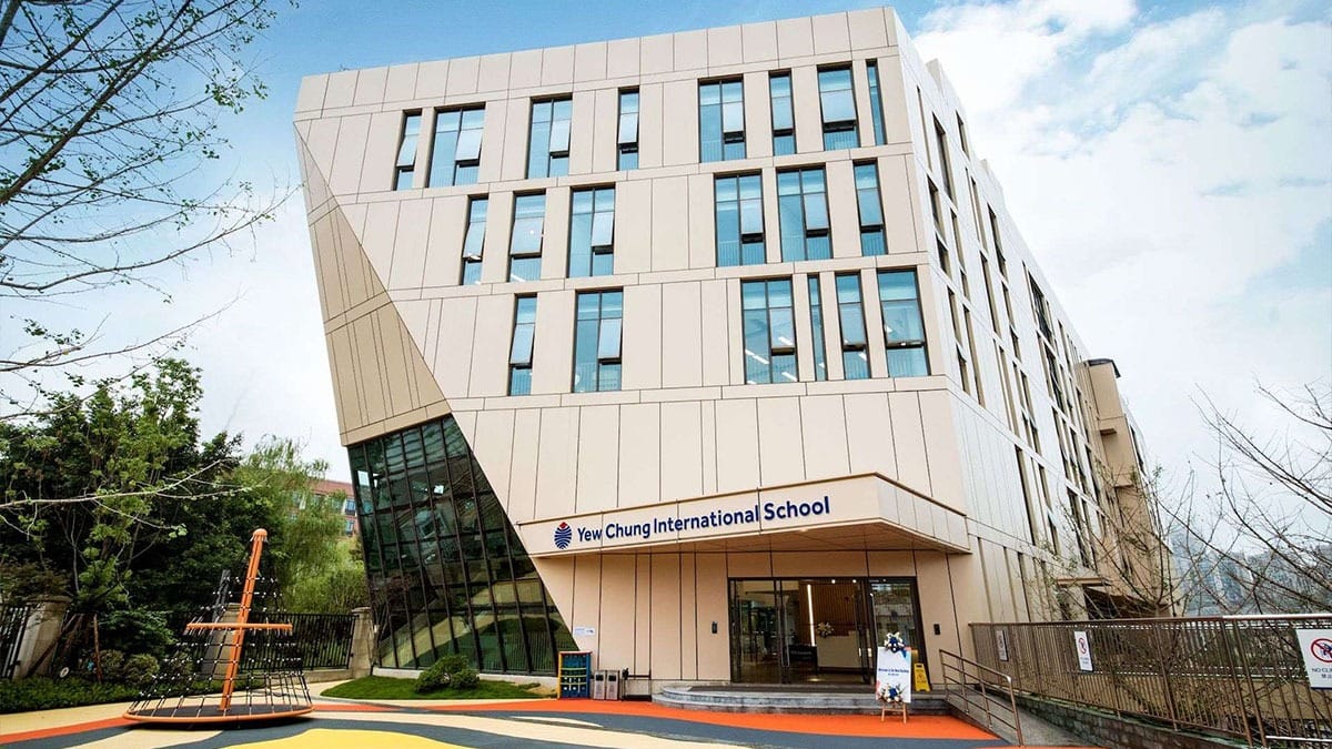 Yew Chung International School of Chongqing modern building exterior with playground area