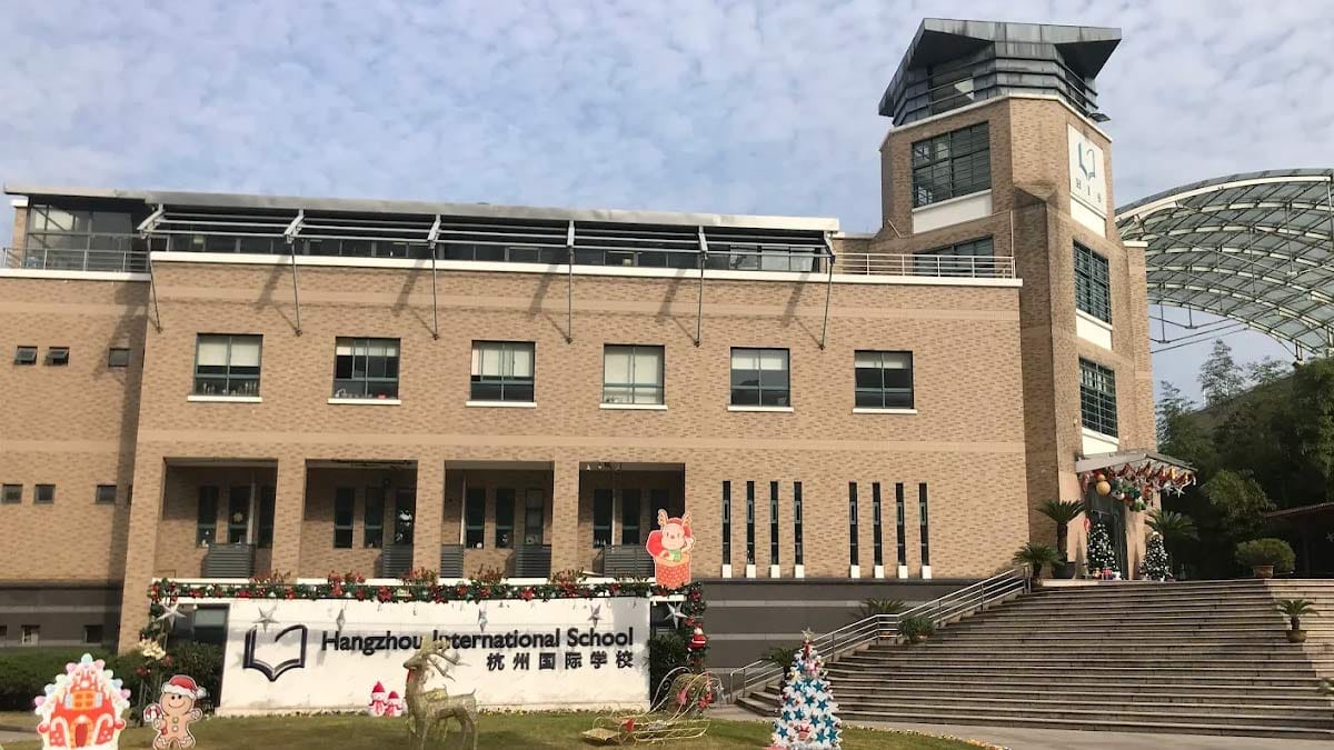 Hangzhou International School brick building with Christmas decorations and signage