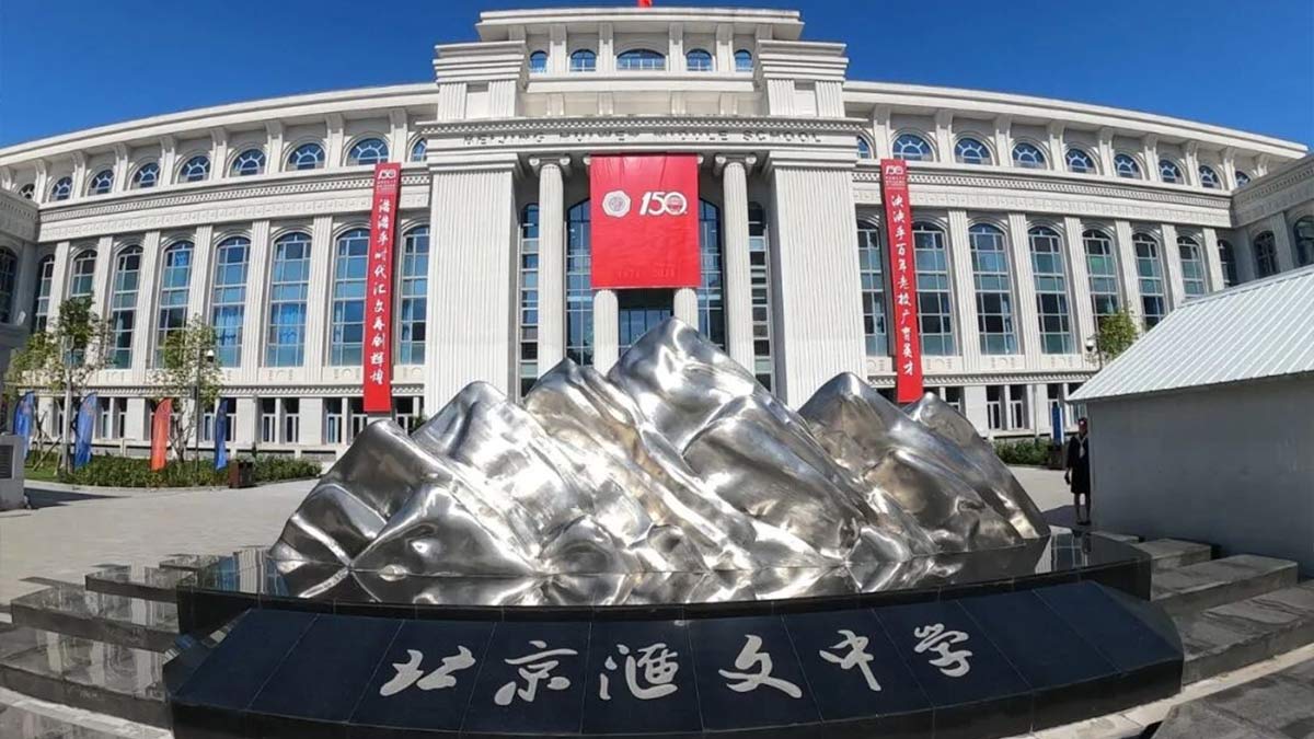 Beijing Huiwen Middle School neoclassical facade with silver mountain sculpture forecourt