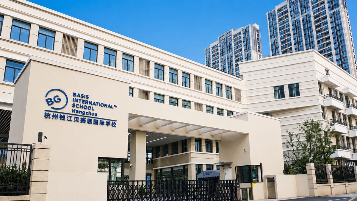 BASIS International School Hangzhou modern cream facade with blue BG logo signage
