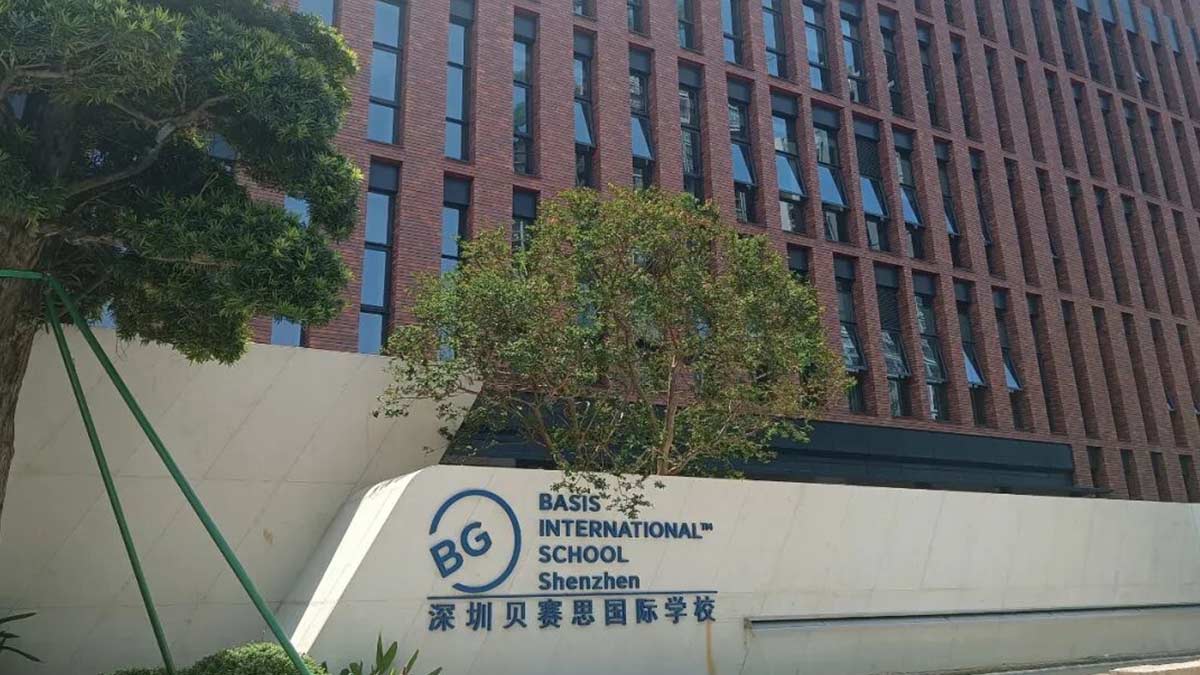 BASIS International School Shenzhen exterior sign against red brick building
