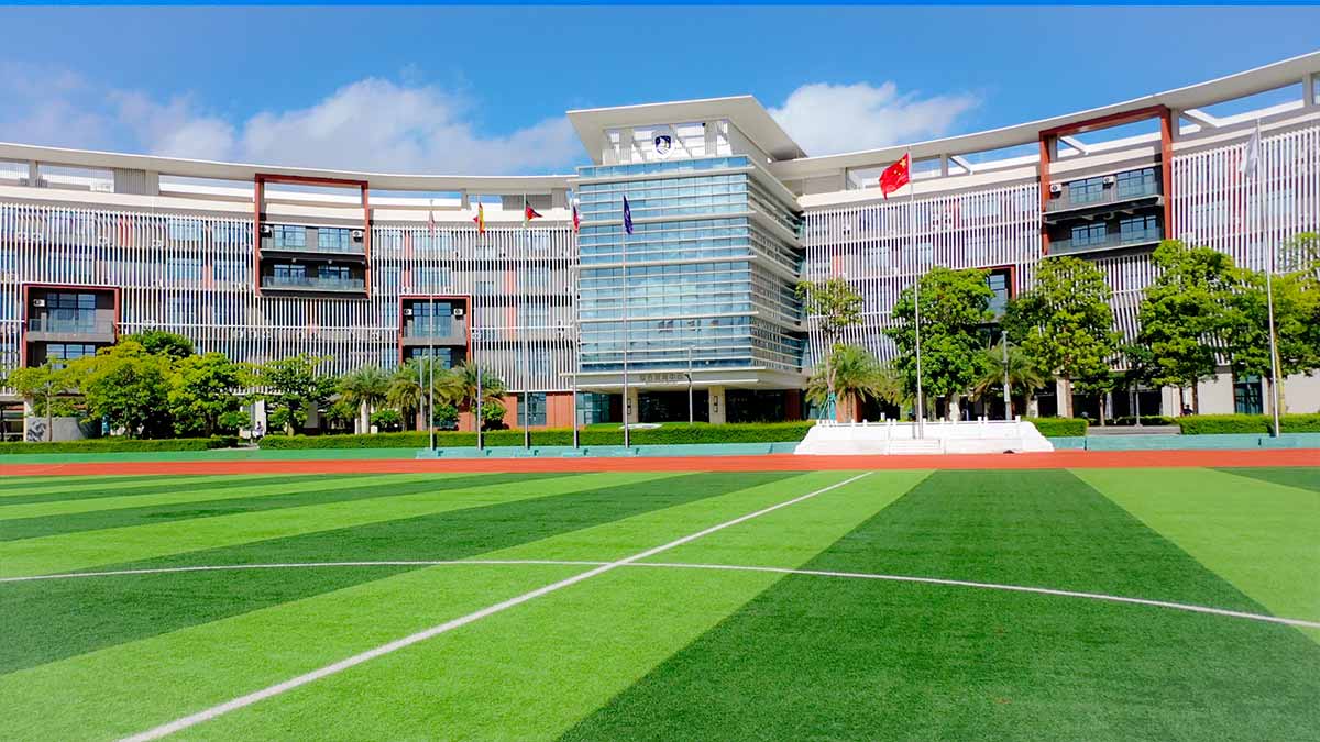 Hainan Foreign Language School BFSU modern campus with green sports field
