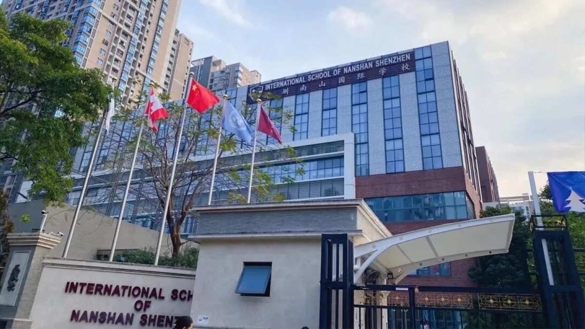 International School of Nanshan Shenzhen gate entrance with multiple flags