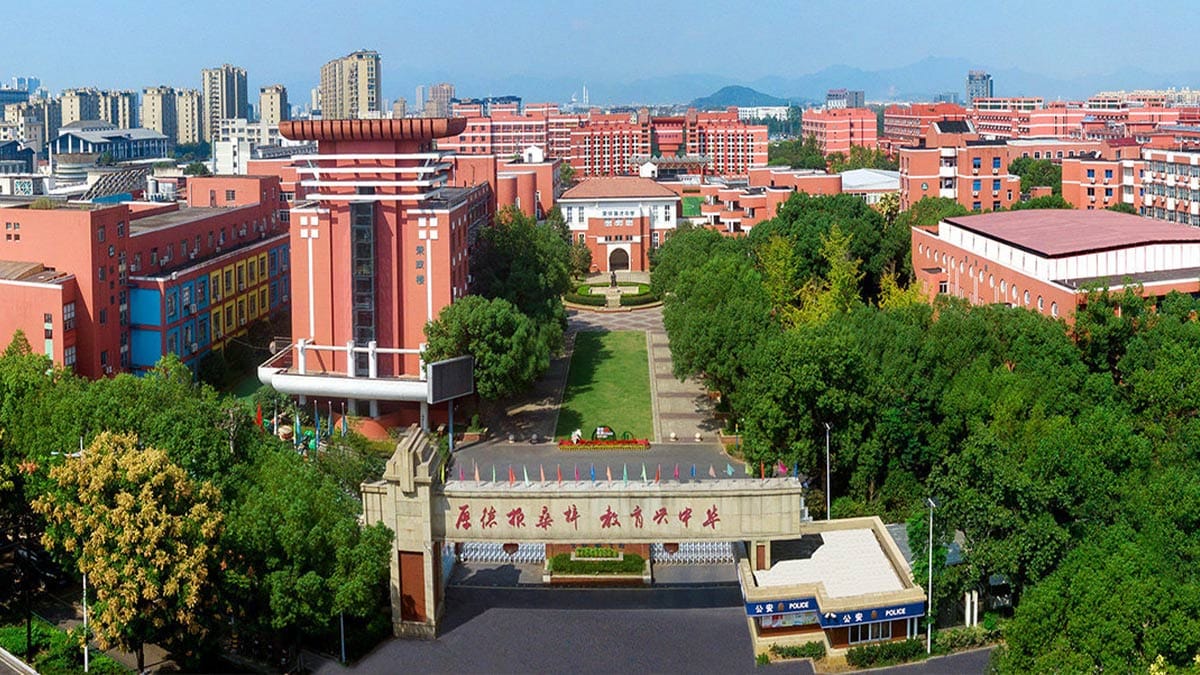 Ronghuai International School aerial view of red-brick campus with tree-lined grounds