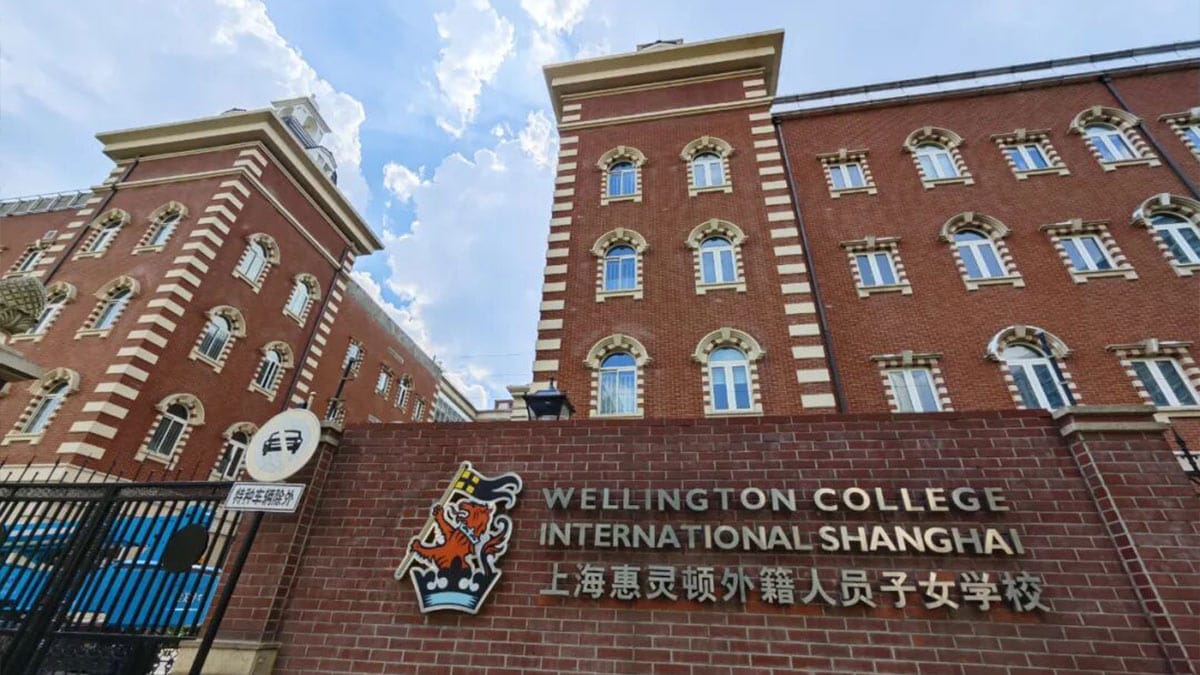Wellington College International Shanghai red brick facade with school crest sign