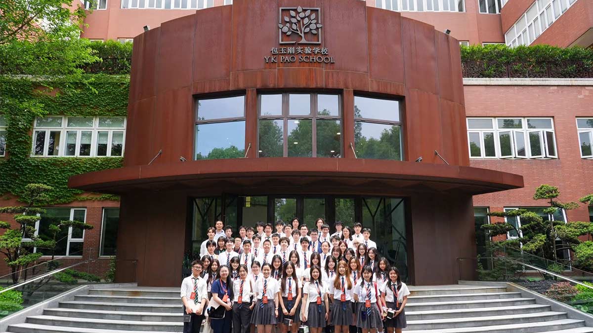 YK Pao School students in uniform gathered on front steps of main building