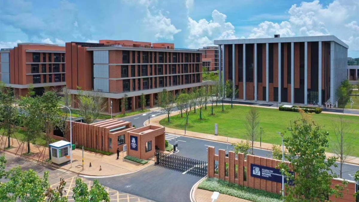 Harrow International School Haikou campus buildings, entrance gate, and green lawns