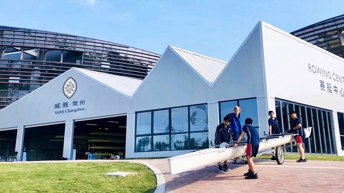  Wycombe Abbey School (WAS) Changzhou students carrying a boat at the Changzhou Rowing Centre