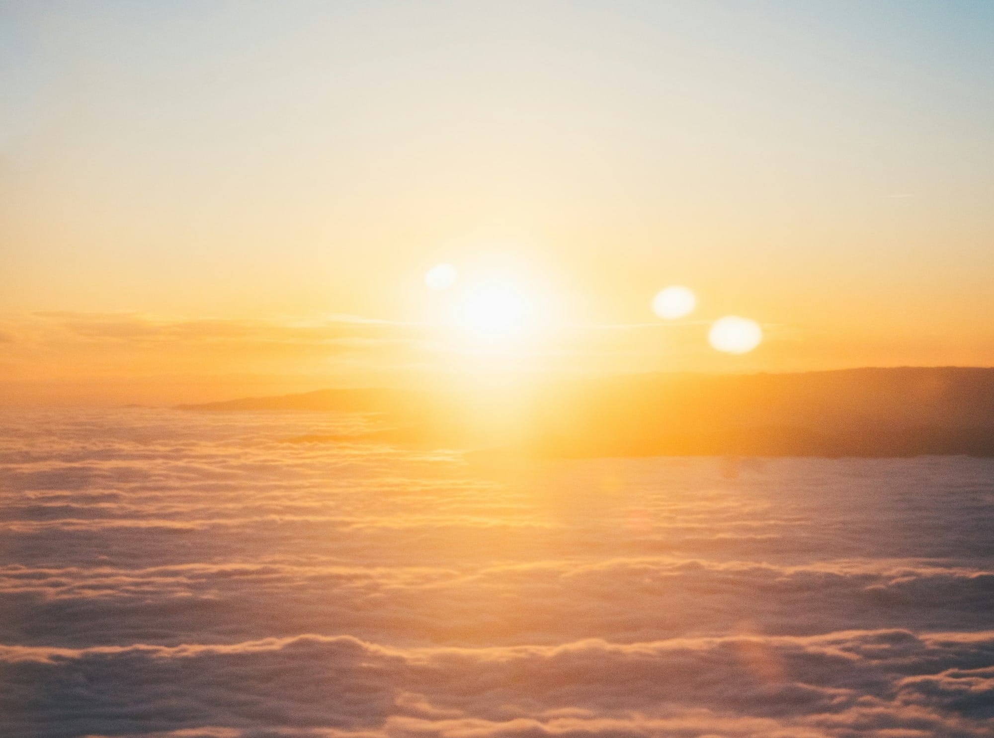 clouds and sun during sunset
