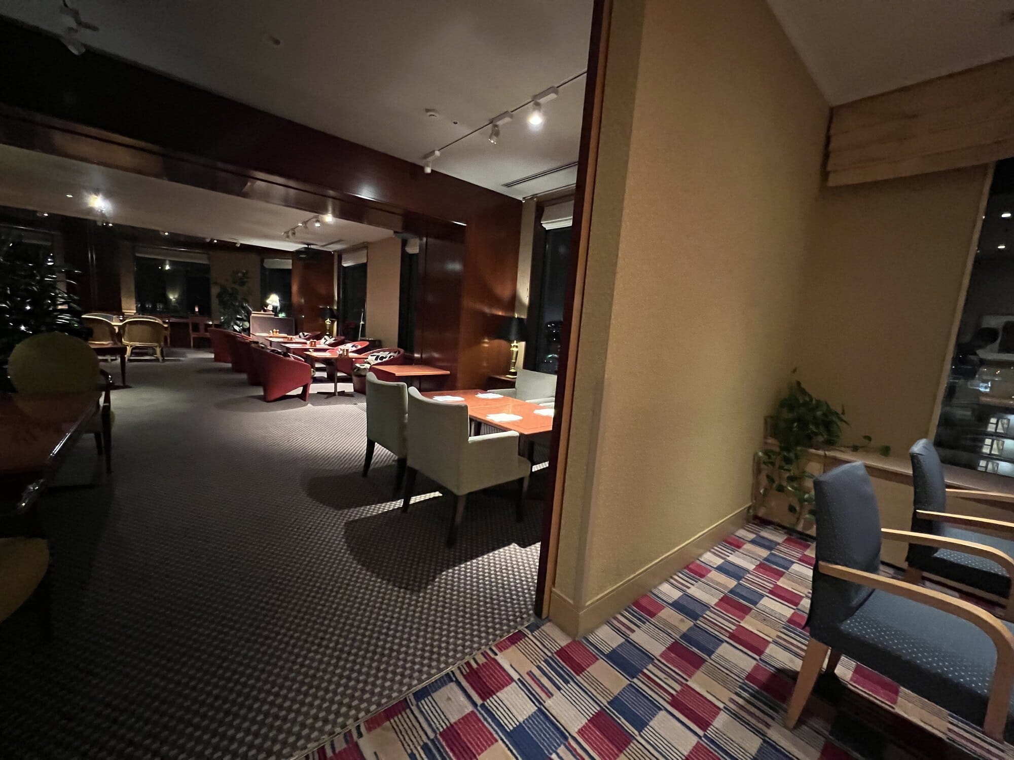 Top-floor restaurant dining room at Authent Hotel Otaru in the evening