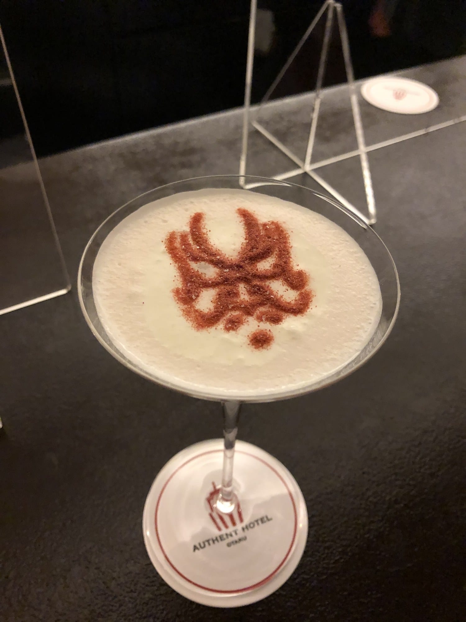 Signature cocktail at Captain's Bar in Authent Hotel Otaru, topped with a kabuki kumadori design in powder