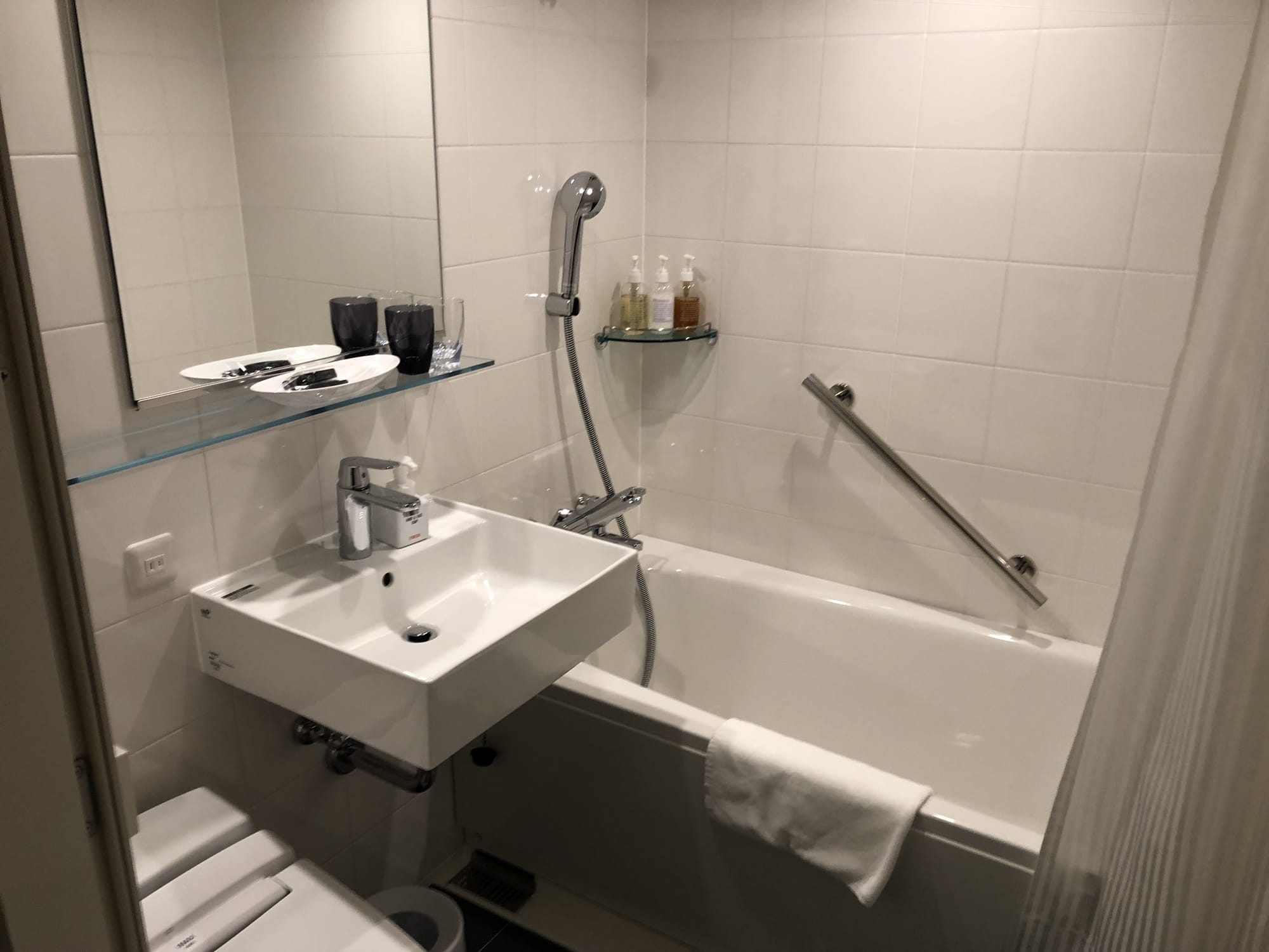 The bathroom at Hotel Forza Kyoto Shijo Kawaramachi, with a separate bathtub and a square sink