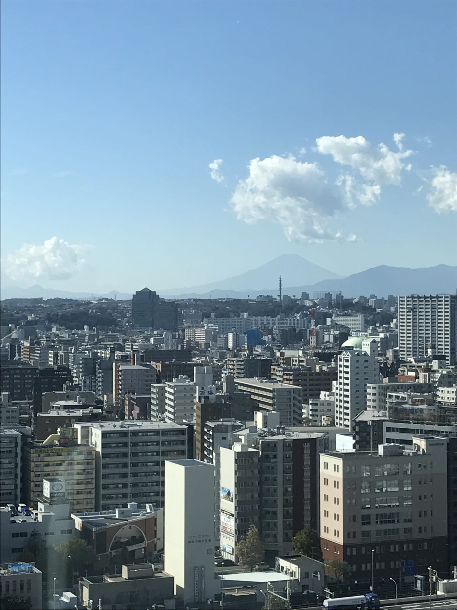 Mount Fuji on the horizon beyond the Yokohama skyline