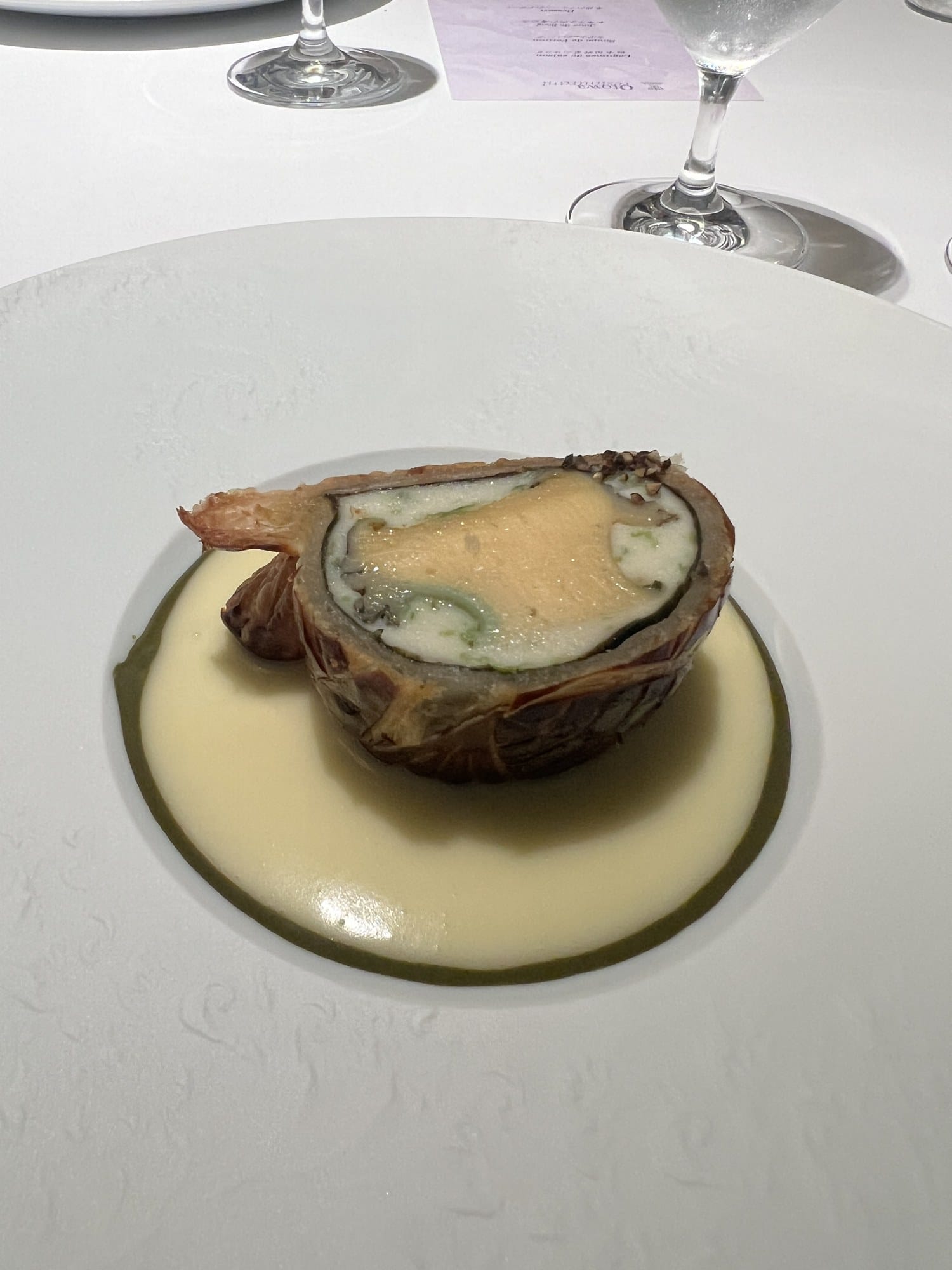 Cross-section of Otowa's abalone in pastry showing the whole abalone inside