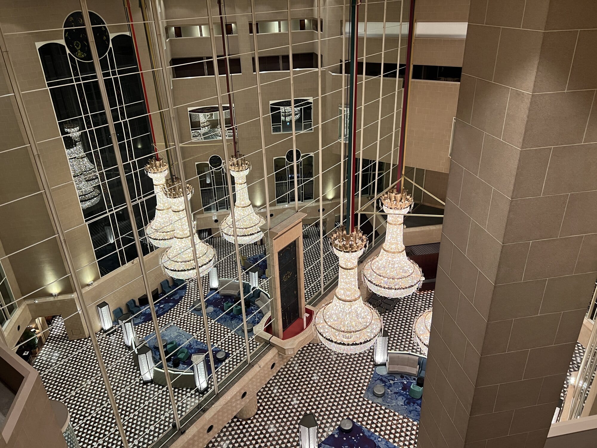 Hilton Tokyo atrium lobby with large chandeliers viewed from an upper floor