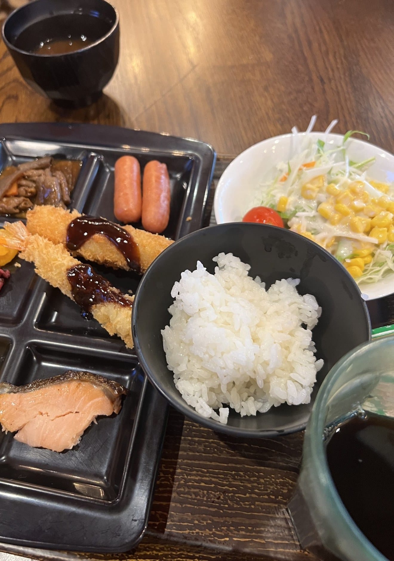 Tray breakfast at APA Hotel Nagoya-Ekimae with fried shrimp in red miso sauce, grilled salmon and rice