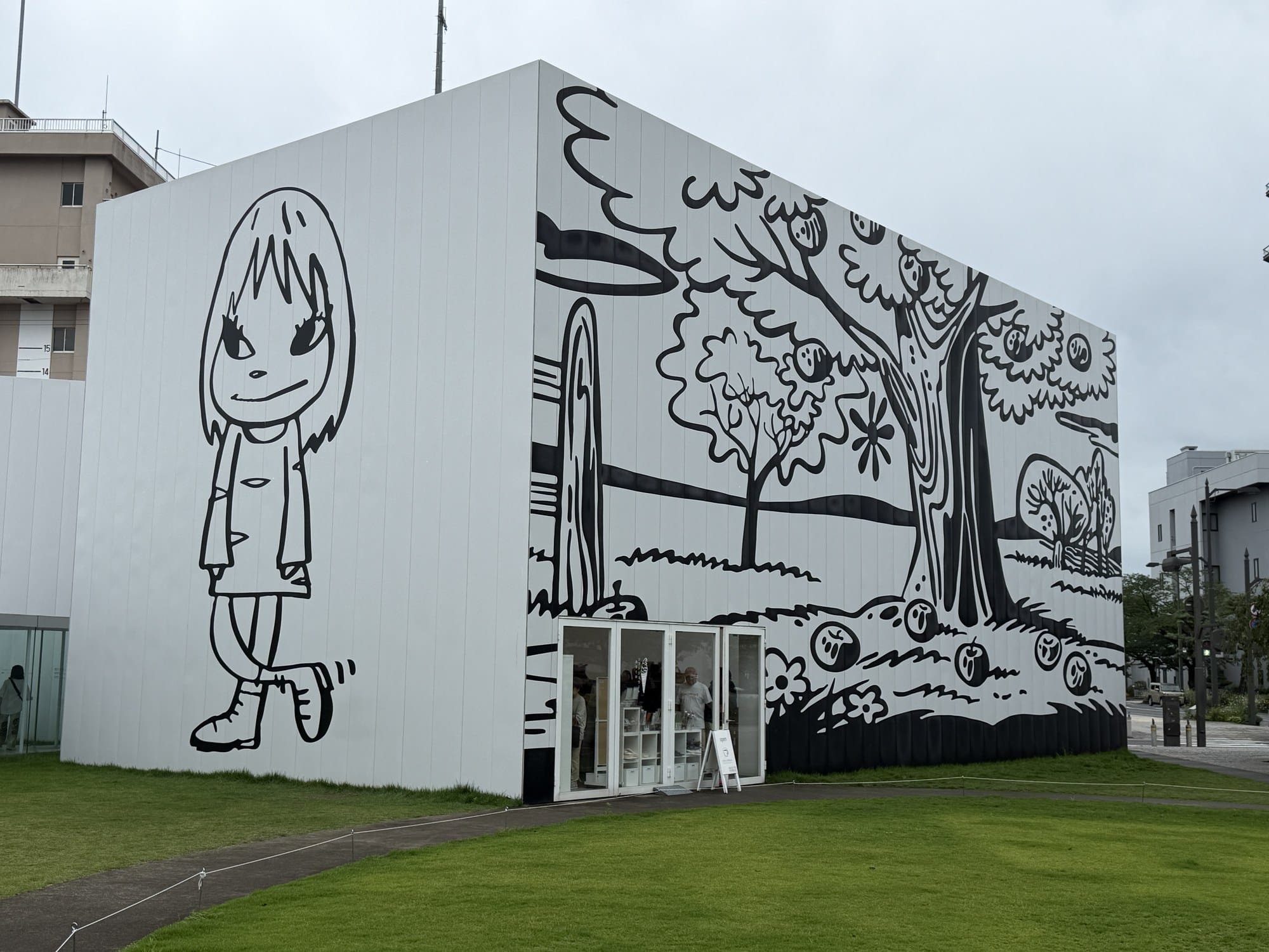 Yoshitomo Nara's Yoroshiku Girl 2012 wall drawing on the exterior of Towada Art Center in Aomori