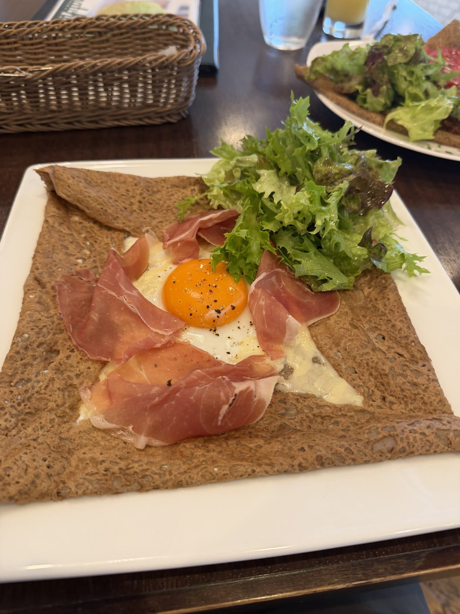 Buckwheat galette with prosciutto, a fried egg, melted cheese and salad at the A-FACTORY restaurant in Aomori