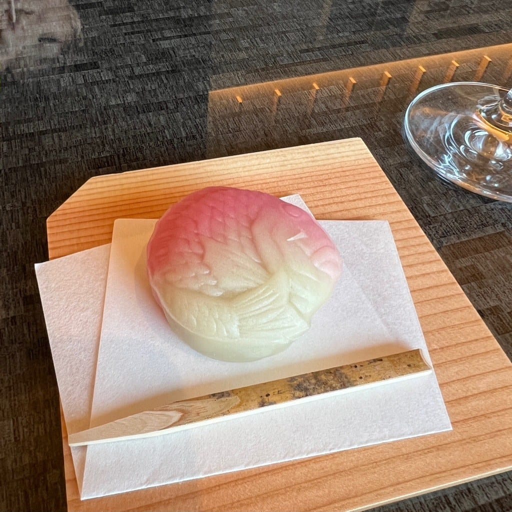 Peach-shaped wagashi sweet and tea served at check-in at The Capitol Hotel Tokyu