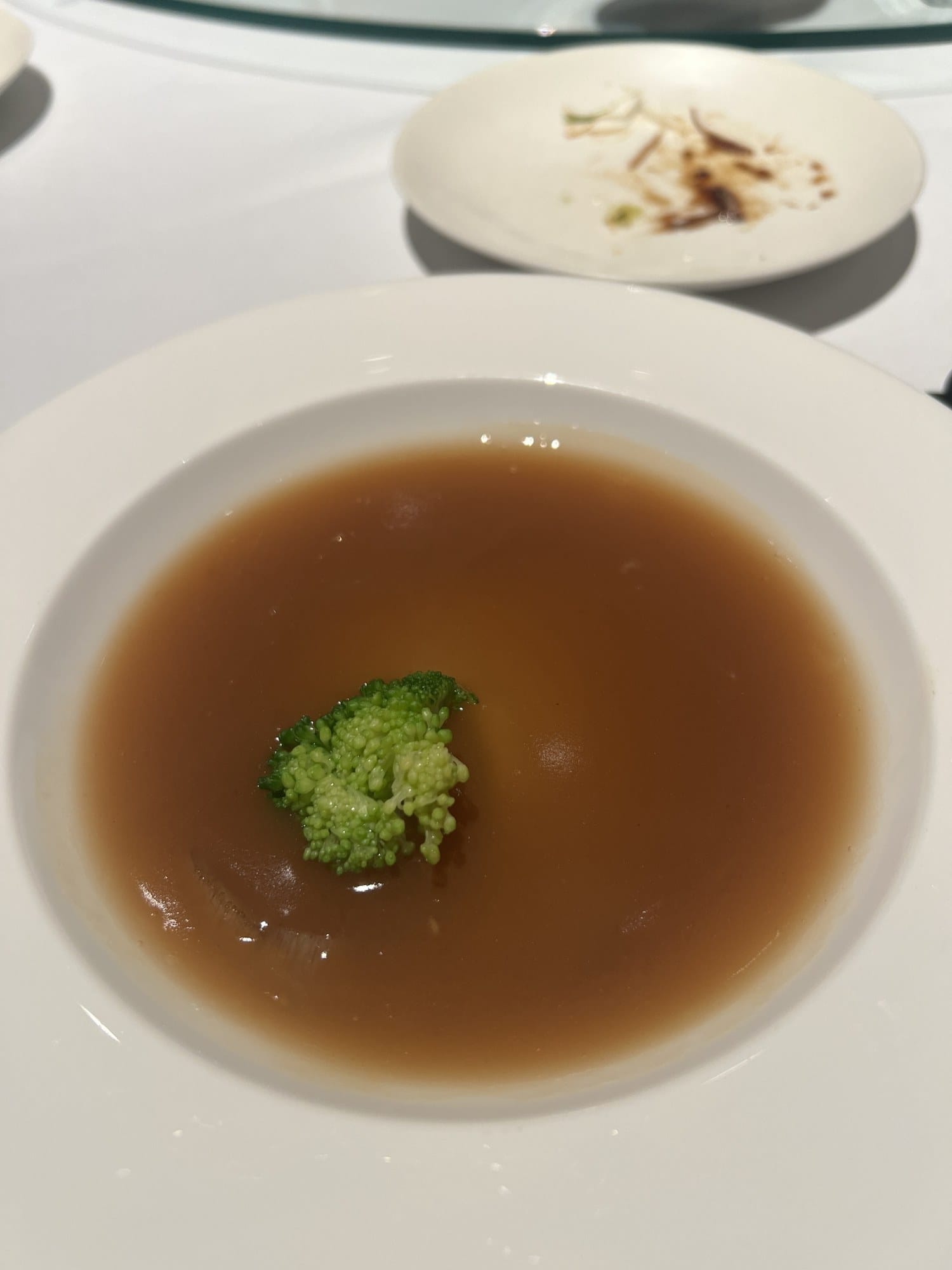 A clear, light-brown soup served at Star Hill, The Capitol Hotel Tokyu