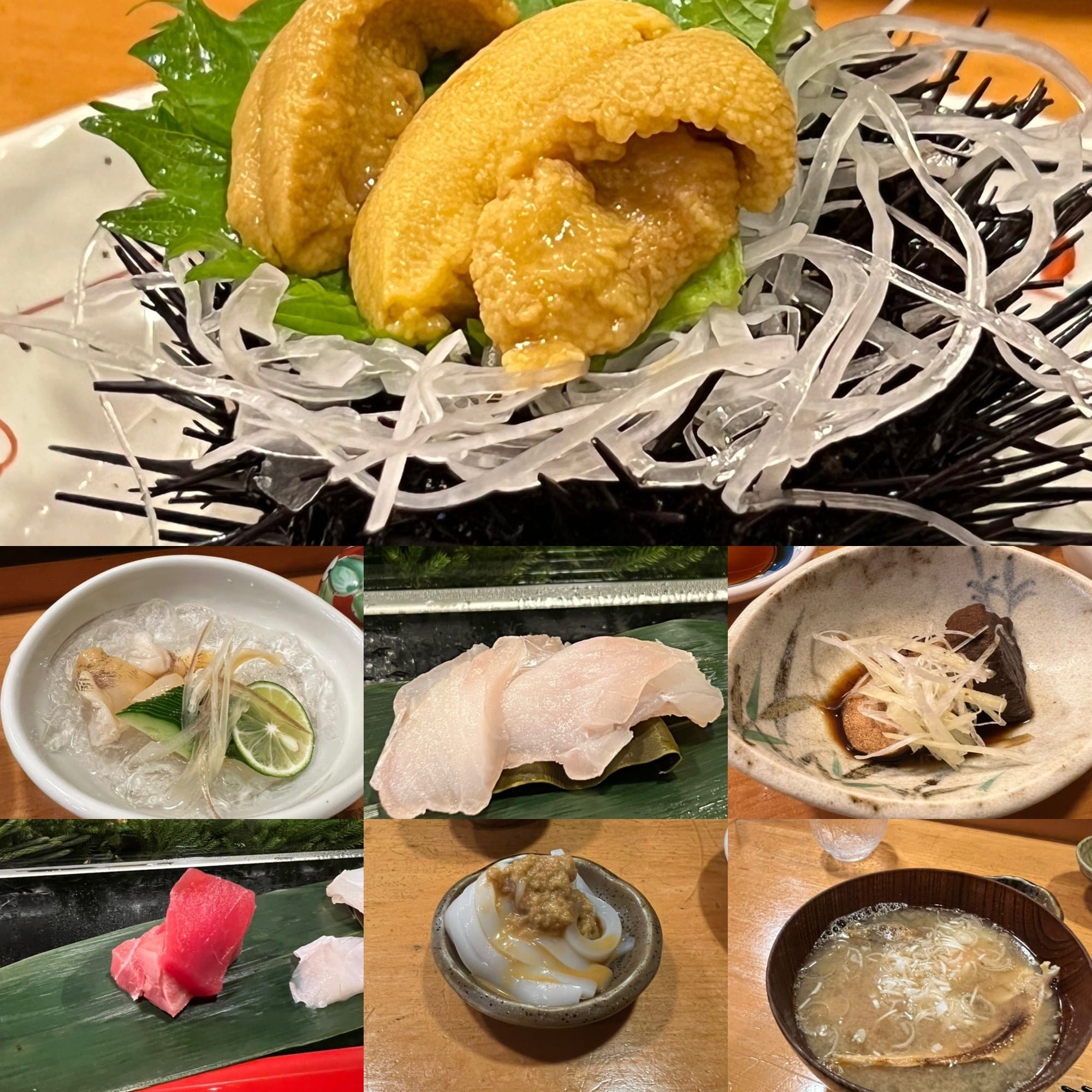 A small plate of sea urchin served in its spiky shell alongside a spread of Shiogama seafood side dishes