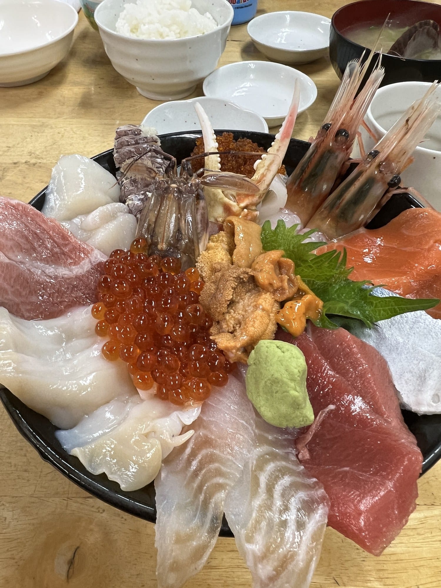A seafood rice bowl piled with sashimi and roe at Ajidokoro Takeda inside the Sankaku Market in Otaru