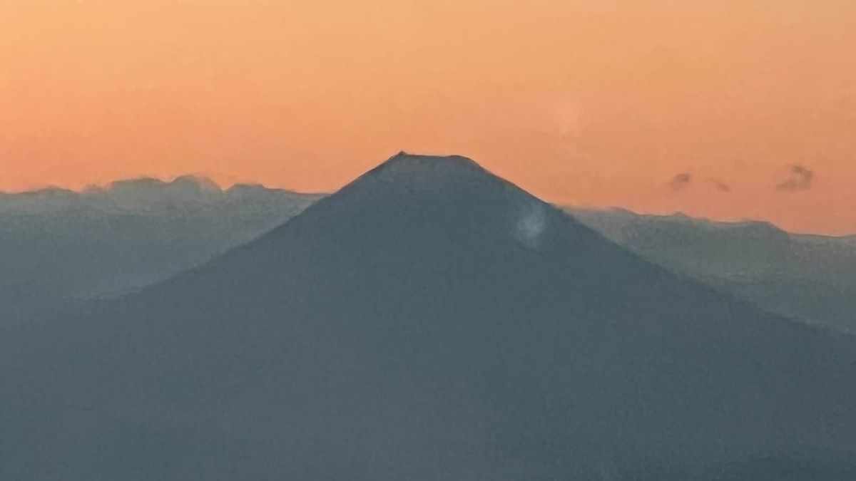 Mount Fuji from the air — one of many reminders that in Japan, where you stay can shape the whole trip.