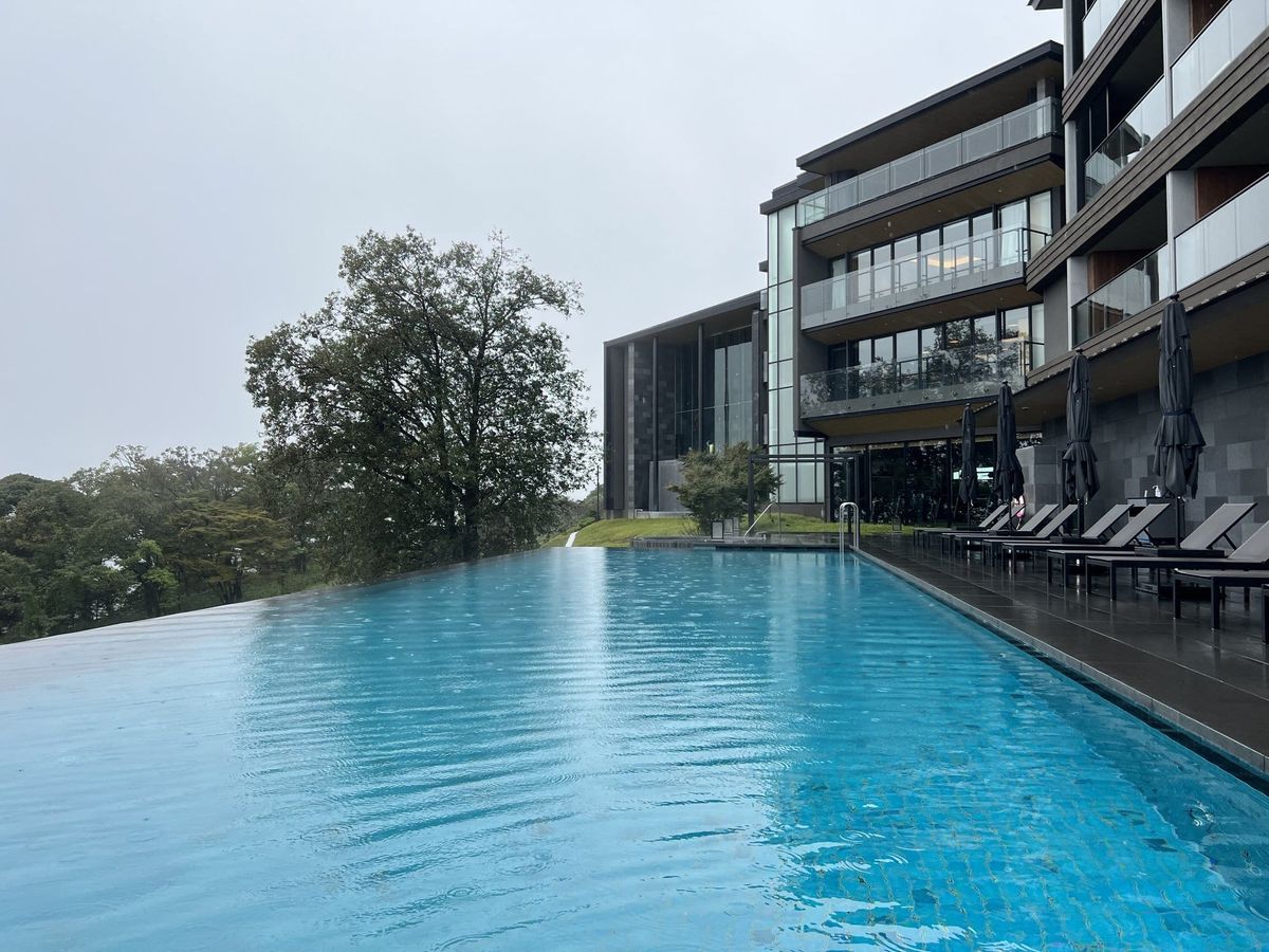 Infinity pool and hillside exterior of ANA InterContinental Beppu Resort and Spa