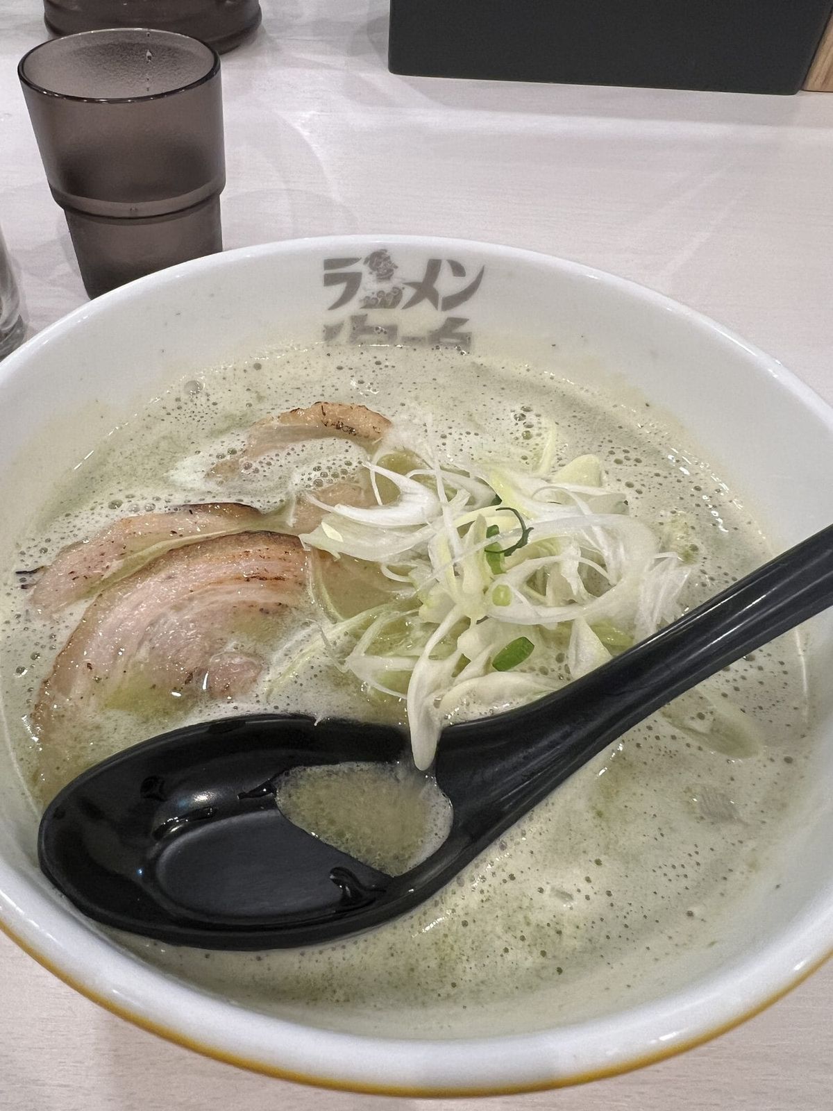 Bowl of Hakata tonkotsu ramen with chashu pork and bean sprouts in milky white broth