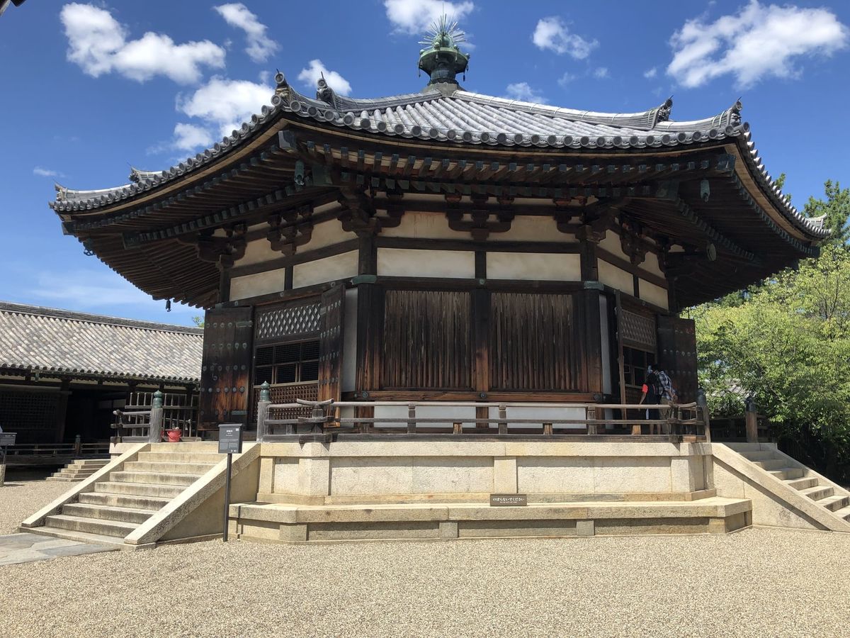 Historic wooden temple hall in Nara on a clear day