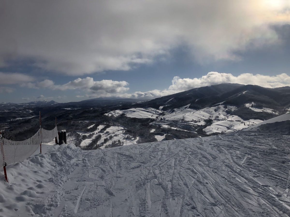 View across ski runs and mountains from the top of Rusutsu Resort