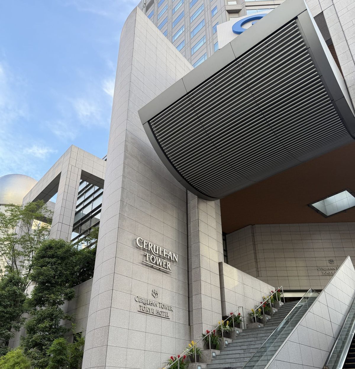 Stone facade and entrance stairs of Cerulean Tower Tokyu Hotel in Shibuya