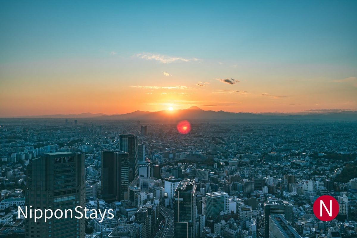 Aerial view of Shibuya, Tokyo at dusk with the city lights coming on