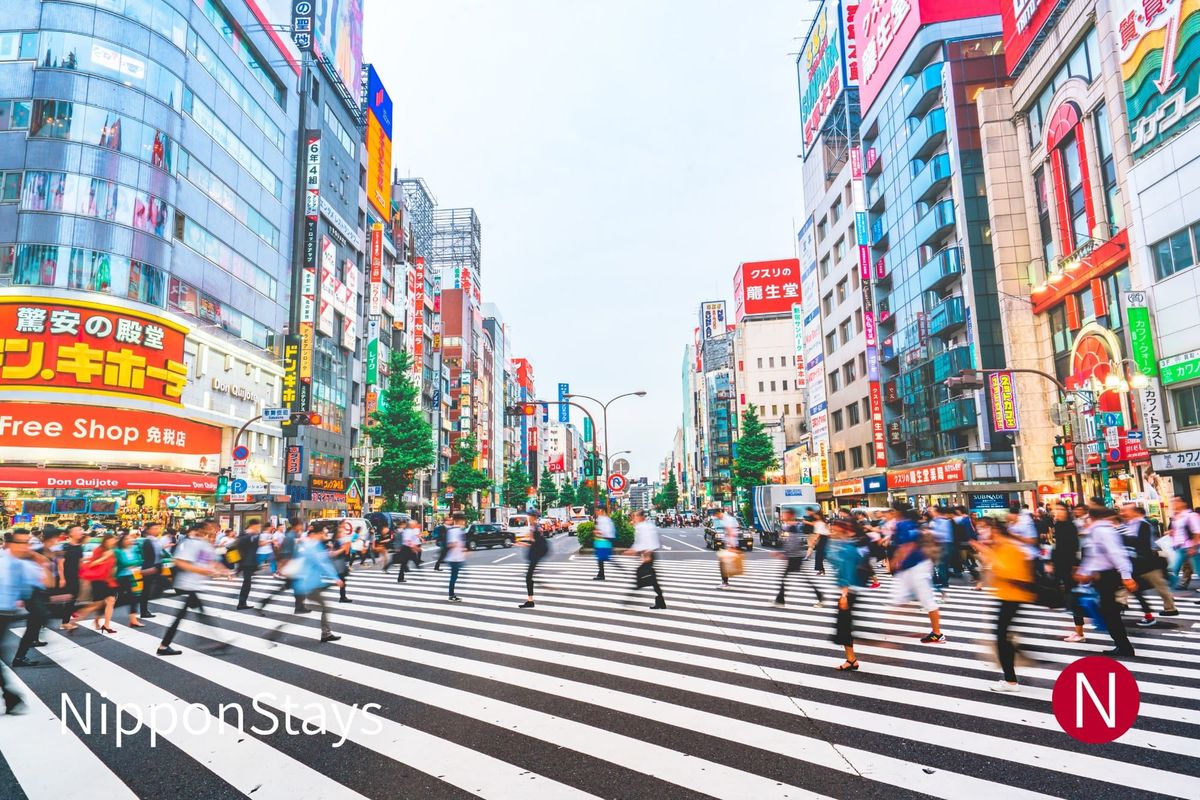 A Shibuya street lined with signage in the afternoon
