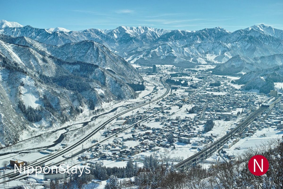 Echigo-Yuzawa town under snow with the surrounding mountains behind