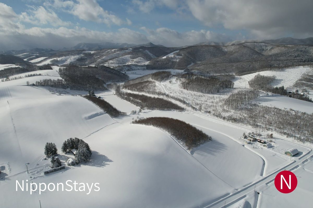 Rolling snow-covered farmland between Furano and Biei
